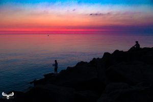 10236 - Fishermen at Hvide Sande pier at sunset