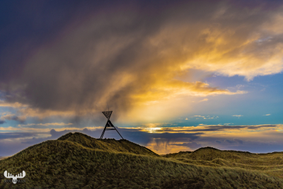 11068 - Husby Klit Båke seamark with sunrise clouds