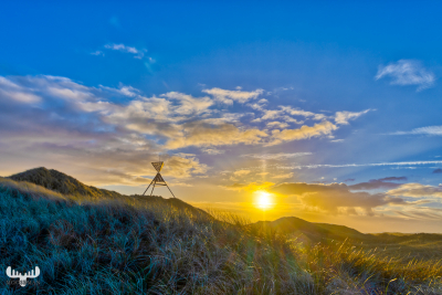 11075 - Husby Klit Båke seamark with sun rising