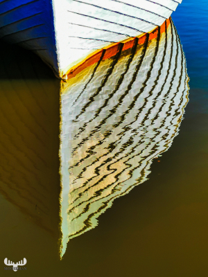 11235 - Ship's bow reflection in Ringkøbing Havn harbor