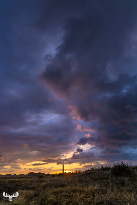 11395 - Nr.Lyngvig Fyr lighthouse with dramatic cloud S bow at sunset