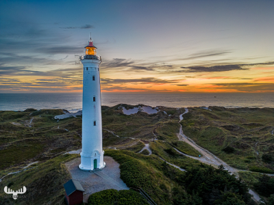 11565 - Nr.Lyngvig Fyr lit at sunset, North Sea and dunes