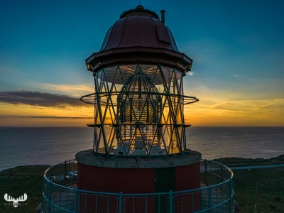 11671 - Bovbjerg Fyr lighthouse - latern room and Fresnel lens with North Sea sunset