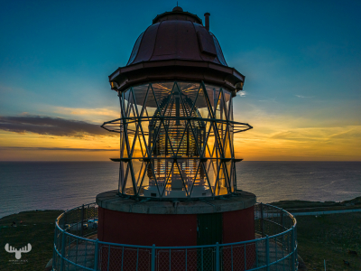 11671 - Bovbjerg Fyr lighthouse - latern room and Fresnel lens with North Sea sunset