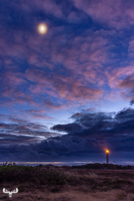 12000 -  Nr.Lyngvig Fyr lighthouse with mooin, clouds and light on