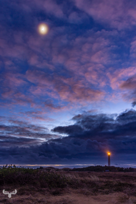 12000 -  Nr.Lyngvig Fyr lighthouse with mooin, clouds and light on