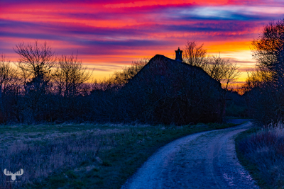 12044 - House in colorful sunset sky