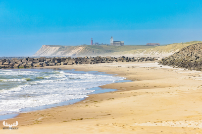 12169 -  - Bovbjerg Fyr lighthouse and Trans kirke behind Northsea and beach at Høfde Q