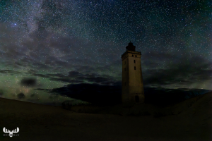 12578 - Rubjerg Knude Fyr lighthouse at night with starry sky an