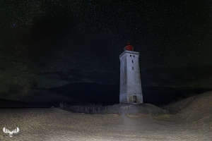 12581 - Rubjerg Knude Fyr lighthouse at night with starry sky, l