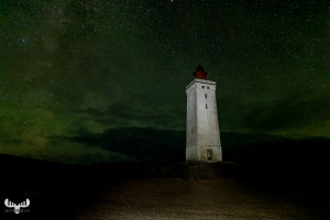 12583 - Rubjerg Knude Fyr lighthouse at night with greenish star