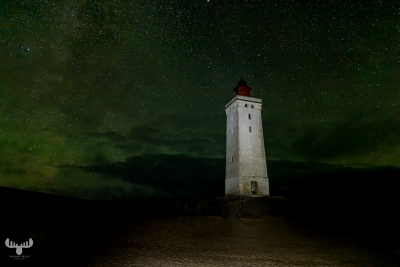 12583 - Rubjerg Knude Fyr lighthouse at night with greenish starry sky, light painted