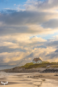 12602 -  - House on cliffs over Løkken beach with sunrise sky