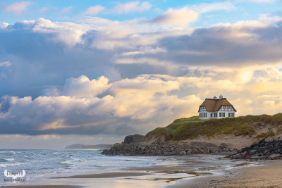 12603 - House on cliffs over Løkken beach at sunrise