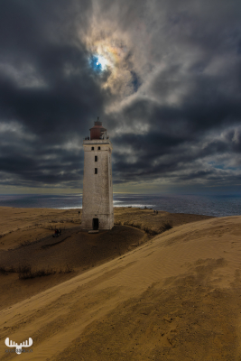 12658 - Rubjerg Knude Fyr ligthouse  - dramatic sky with opening for sun