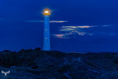 12794 - Nr.Lyngvig Fyr lighthouse at night with moon shining through clouds