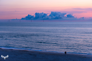 12800 - Soft sunset colors at North Sea beach with persons
