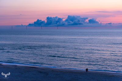 12800 - Soft sunset colors at North Sea beach with persons