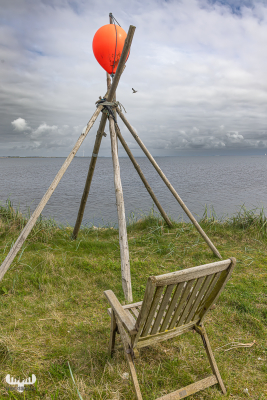 12936 - Chair, fishing poles and floater with Ringkøbing Fjord view