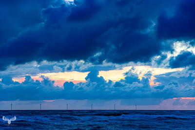 13066 - Sunset sky with offshore wind power plants at North Sea