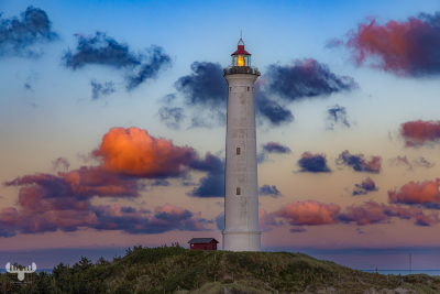 13071 - Nr.Lyngvig Fyr lighthouse with sunset clouds
