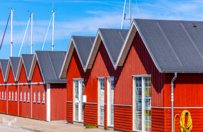 13283 - Red huts at harbor