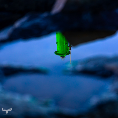 13555 - Reflection of green pier fire at Hvide Sande harbour