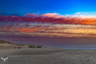 14364 - Colorful sunset at Søndervig North Sea beach with bunkers and people