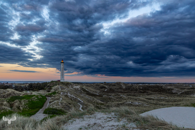 14464 - Nr.Lyngvig Fyr lighthouse  with dark sky at sunset