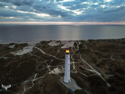 14478 - Nr.Lyngvig Fyr lighthouse at  dusk with lit lantern