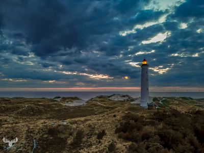 14479 - Nr.Lyngvig Fyr lighthouse at dusk with North Sea and wind turbines