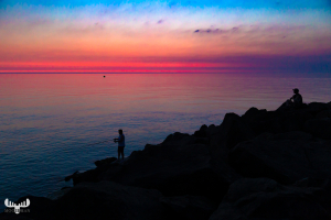 10236 - Fishermen at Hvide Sande pier at sunset