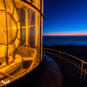 11221 - Nr.Lyngvig Fyr lighthouse - Fresnel lens at night with North Sea sunset