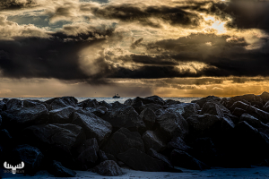 13540 - Fishing boat between dramatic clouds and Hvide Sande pier, art