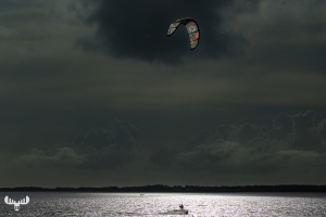 13985 - Kitesurfer on Ringkøbing Fjord with dark sky