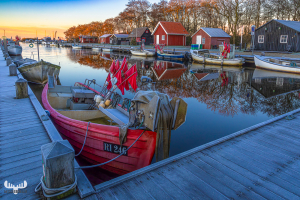 14133 - Frosty sunrise with fishing boats and huts at Stauning Havn harbour