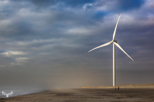 14301 - Wind turbine in stormy light at Hvide Sande North Sea beach