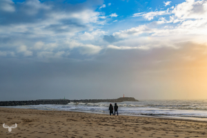 14315 - Two people at Hvide Sande beach with pier