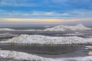 14318 - Ringkøbing Fjord in winter with ice piled up at sunset