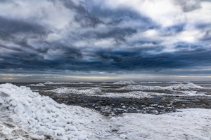 14321- Ringkøbing Fjord in winter with ice piled up and dramatic sky
