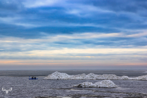 14331 - Ringkøbing Fjord in winter with ice piled up and blue kayak