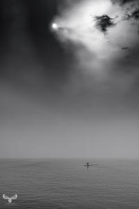 14410 - SUP on North Sea woth dramatic sky, B/W