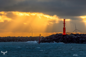 14534 - Hvide Sande Pier with red beacon and wind turbine at sunset