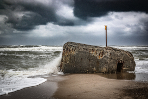14662 - Bunker with warning sign at rough North Sea, art version